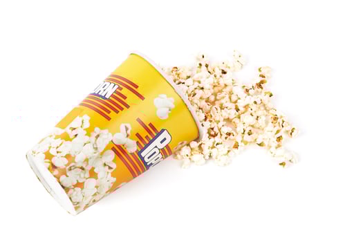 Scattered popcorn from bucket photo
