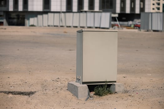 Gray metallic box with supplies at the construction site. iron container. photo