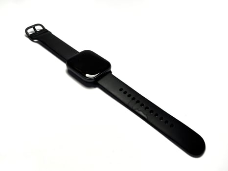 Black smart watch isolated on white background. Smartwatch that has been used with black strap. Copy space for text. photo