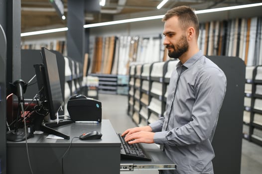 A seller in a wallpaper store photo