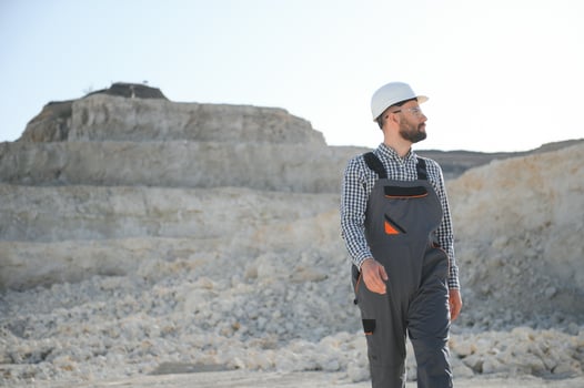 Worker and quarry in background photo
