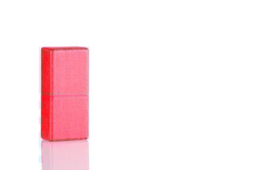 Wooden cube of red color on a white background photo