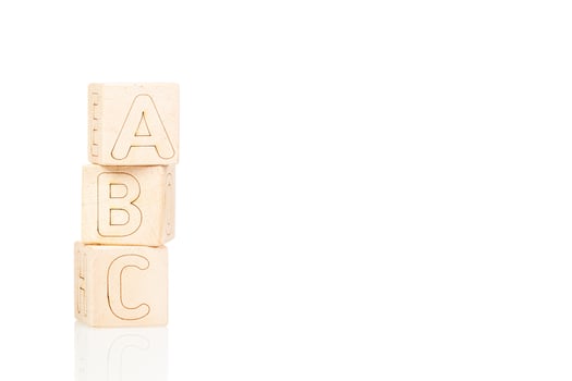 Wooden cubes with letters ABC on a white background photo