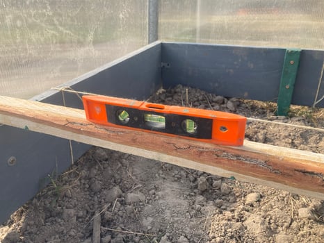 Installing wooden beds in a greenhouse photo