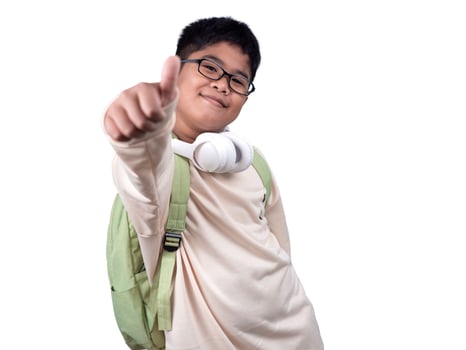Portrait of boy in casual clothes carry a green bag and white headphones isolated on a white background, The concept of education and way of life. Cute boy posing in casual clothes with clipping part. photo
