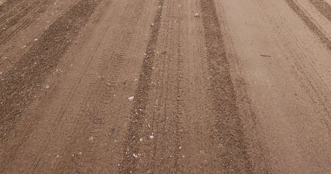 close-up of a part of a wet road without asphalt photo