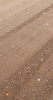 close-up of a part of a wet road without asphalt photo