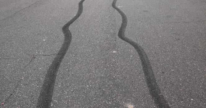 tire tracks during dangerous driving on the road photo