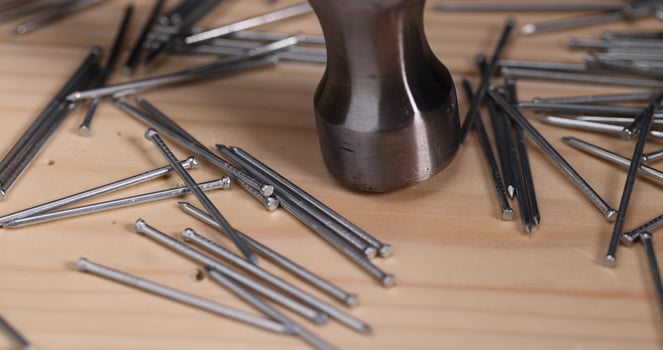 hammer and small galvanized nails for decorative work photo