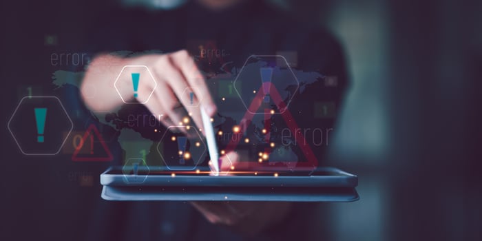 Programmer and virtual icons , exclamation mark ,alarm,computer virus detected ,danger warning concept or information error that should be urgently fixed and repaired ,Notification of security issues photo