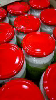 Rows of jars with red lids suggest food preservation concept ideal for stockpiling and emergency preparedness photo