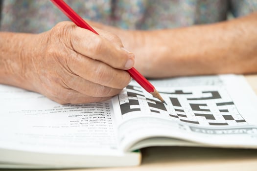 Bangkok, Thailand September 1, 2022 Alzheimer disease AD, Asian elderly woman playing sudoku puzzle game to practice for dementia prevention. photo