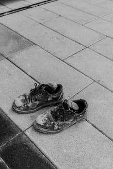 hard work shoes in Dubai street construction worker Conceptual shooting of shoes photo