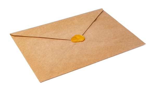 Recycled craft paper envelope isolated white background photo