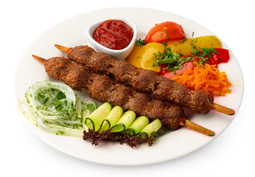 Grilled lula kebab on stick on white background isolated photo