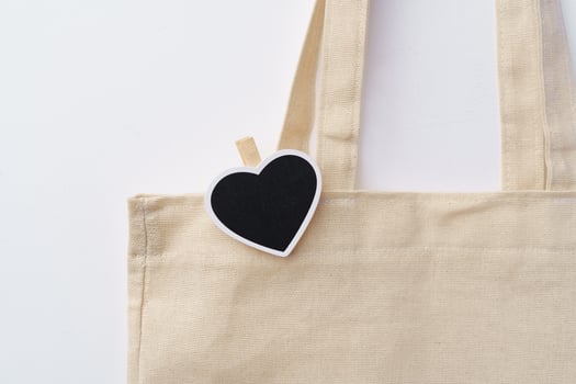 Cotton tote shopper bag with heart tag on white background photo