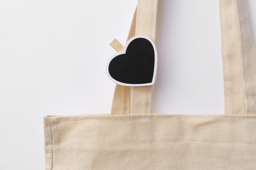Cotton tote shopper bag with heart tag on white background photo