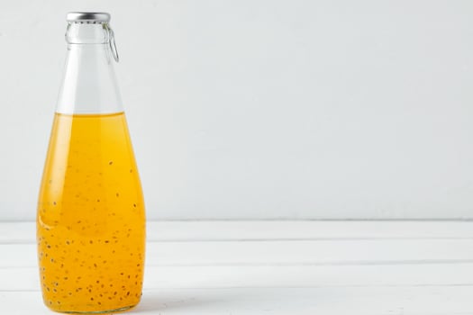 Basil seed drink in glass bottle on white background photo