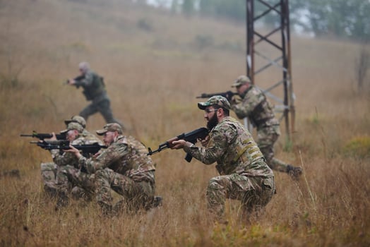 A disciplined and specialized military unit, donned in camouflage, strategically patrolling and maintaining control in a high-stakes environment, showcasing their precision, unity, and readiness for photo