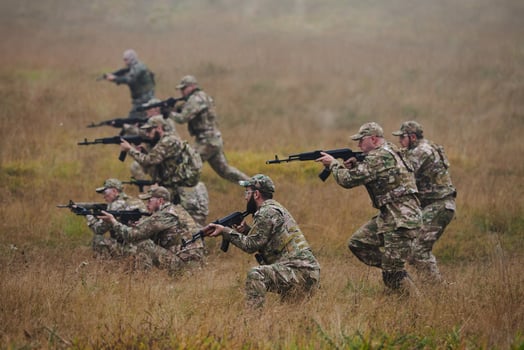 A disciplined and specialized military unit, donned in camouflage, strategically patrolling and maintaining control in a high-stakes environment, showcasing their precision, unity, and readiness for photo