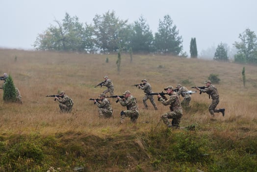 A disciplined and specialized military unit, donned in camouflage, strategically patrolling and maintaining control in a high-stakes environment, showcasing their precision, unity, and readiness for photo