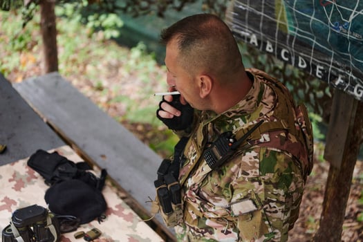 The esteemed leader of an elite military unit, strategic brilliance unfolds as he meticulously devises tactical plans for the upcoming military operation, surrounded by cutting-edge technology and a photo