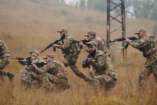 A disciplined and specialized military unit, donned in camouflage, strategically patrolling and maintaining control in a high-stakes environment, showcasing their precision, unity, and readiness for photo
