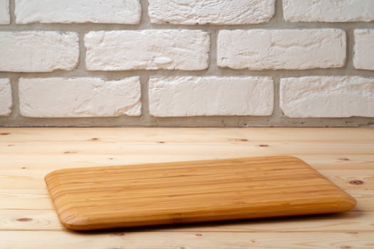 Wooden board for food on wooden background photo