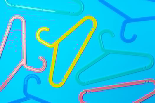 Blue hanger on trendy blue color background. Template fashion blog social media. photo