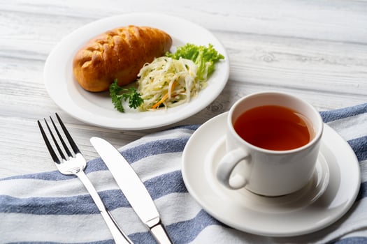 Traditional Russian pie or patty on white plate photo