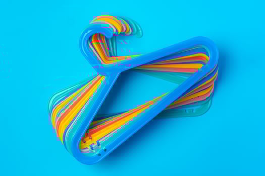 Blue hanger on trendy blue color background. Template fashion blog social media. photo