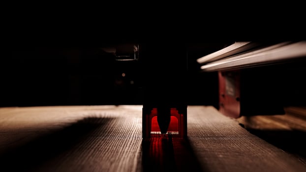 The process of laser wood cutting. A laser machine precisely carves lines on the surface, creating detailed and accurate designs. Perfect for themes of high-tech and manufacturing photo