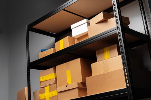 Rack shelves with paper boxes in warehouse. photo