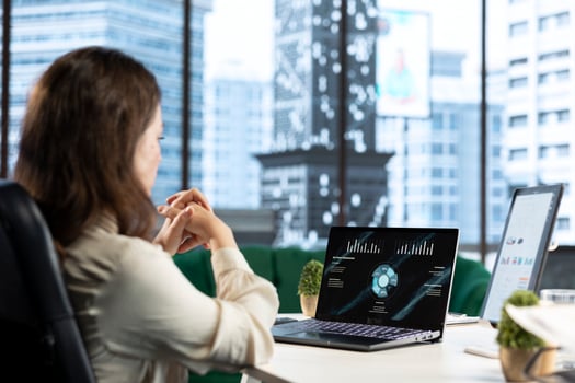Forecast expert CEO analyzing investment insights and negotiations details, looking at data analytics and reports to establish the corporation vision and objectives. Business productivity. photo