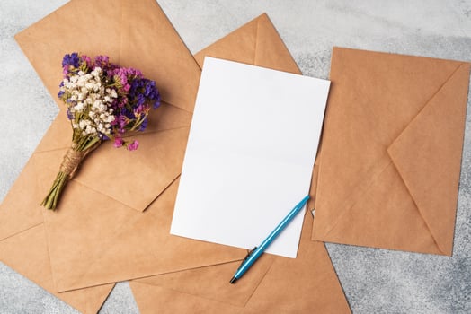 envelope and blank paper card with copy space mock up. photo