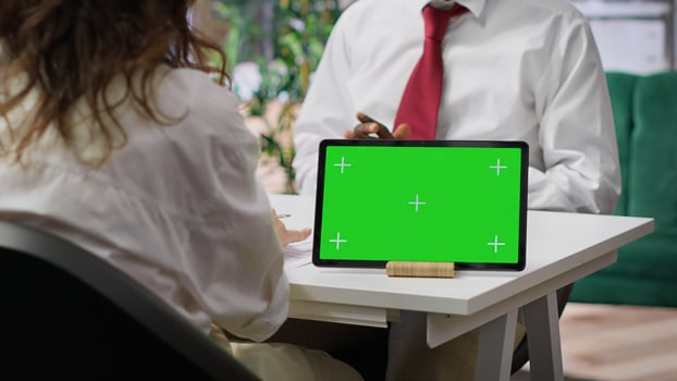 Recruiters and job applicant attending an interview with isolated copy space device, HR staff asking candidate about career achievements and goals. Reading qualifications on the resume. Camera A. photo