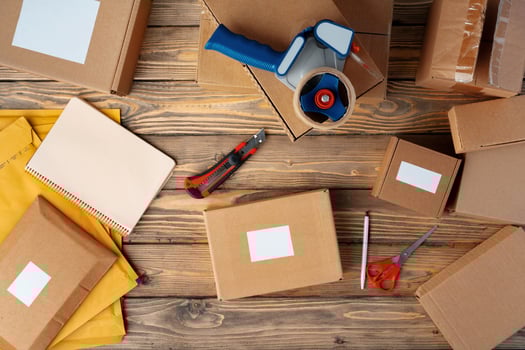 Packing products for delivery on wooden table, top view photo