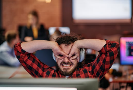 Joyful Collaboration. A Man Embracing Remote Work with Enthusiastic Gestures in a Coworking Space. photo