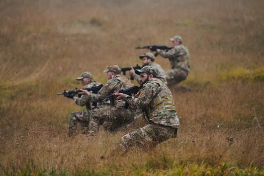 A disciplined and specialized military unit, donned in camouflage, strategically patrolling and maintaining control in a high-stakes environment, showcasing their precision, unity, and readiness for photo