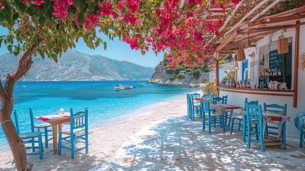Turquoise sea water and boats on a sunny day at a greek beach with a cozy restaurant photo