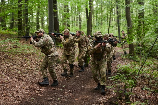 A specialized military antiterrorist unit conducts a covert operation in dense, hazardous woodland, demonstrating precision, discipline, and strategic readiness photo