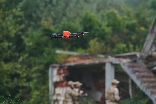 Elite military unit, equipped with state-of-the-art technology including a drone, strategically navigates and surveys dangerous wooded terrain, showcasing their precision, cooperation, and specialized photo