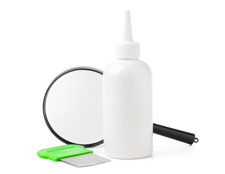 Medicine, lice comb and magnifying glass isolated on white photo