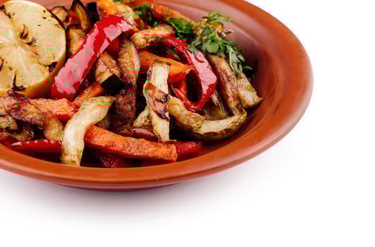 Grilled vegetables on plate with lemon, healthy vegan lunch photo