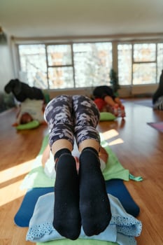 Senior Women Embrace Wellness. Yoga and Stretching in a Sunlit Space photo