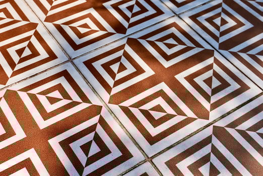 Abstract decorative brown and white floor tile pattern object isolated on horizontal ratio background. photo