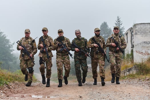 A disciplined and specialized military unit, donned in camouflage, strategically patrolling and maintaining control in a high-stakes environment, showcasing their precision, unity, and readiness for photo