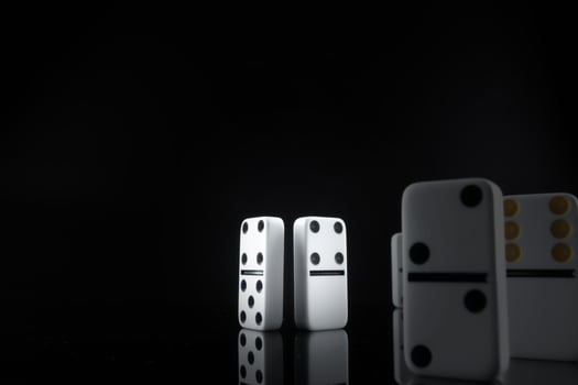 Close up of Domino pieces on black background photo