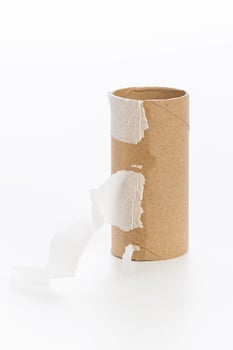 Empty toilet paper on white background photo