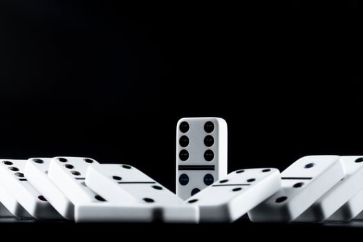 Domino pieces put in a row on black background photo
